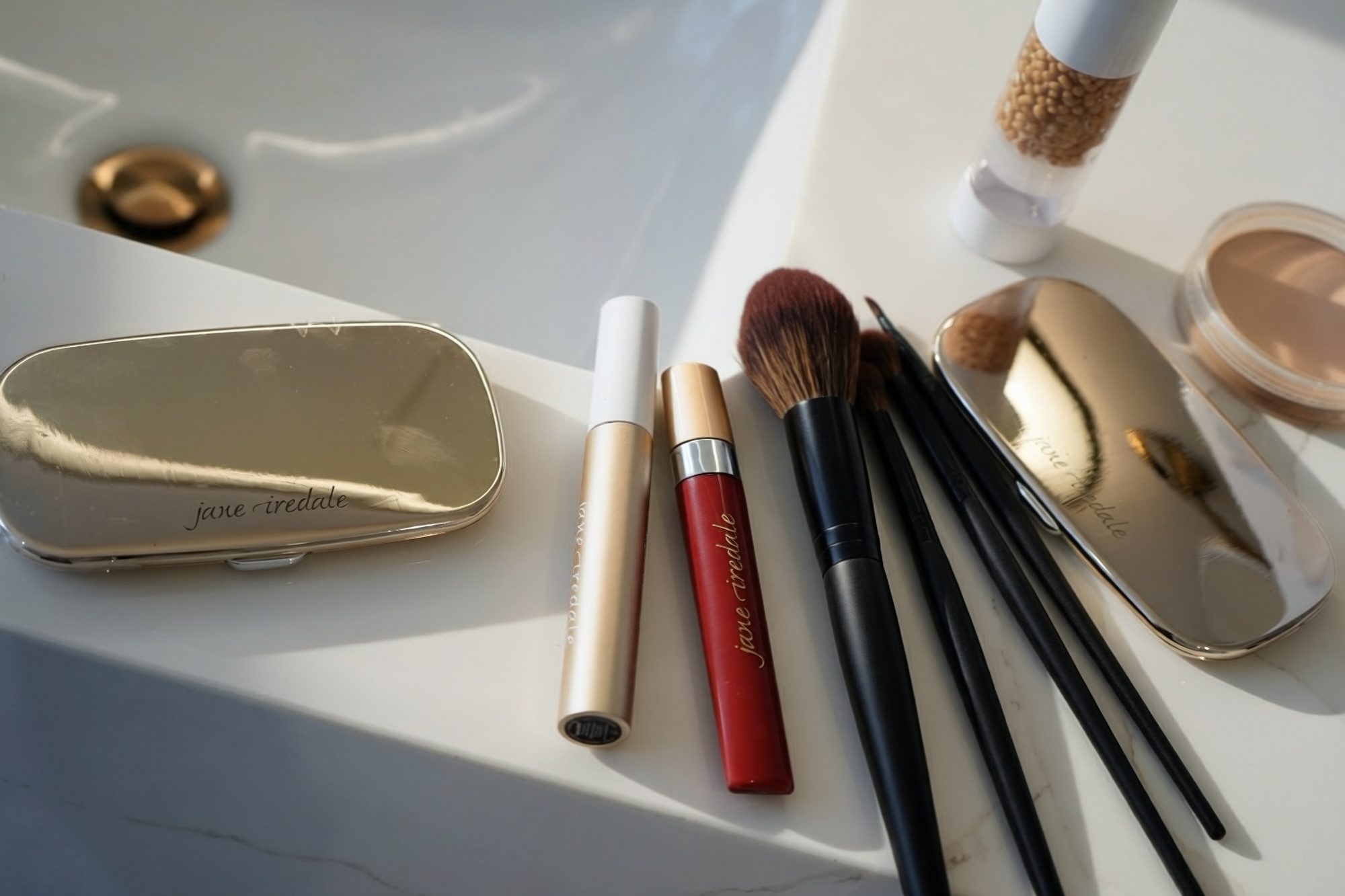Jane Iredale makeup and brushes on the studio counter